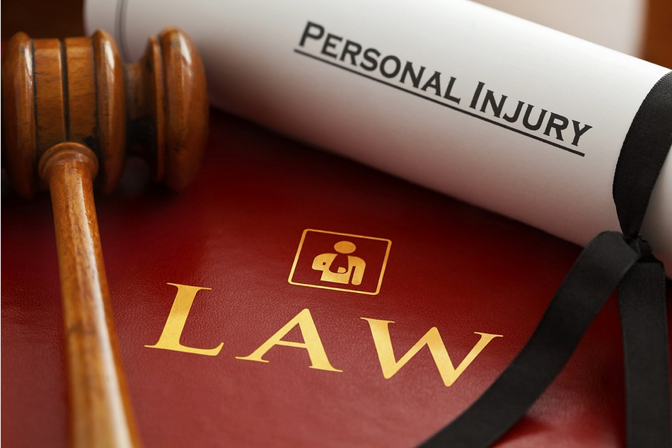a personal injury law book with a judge's gavel.