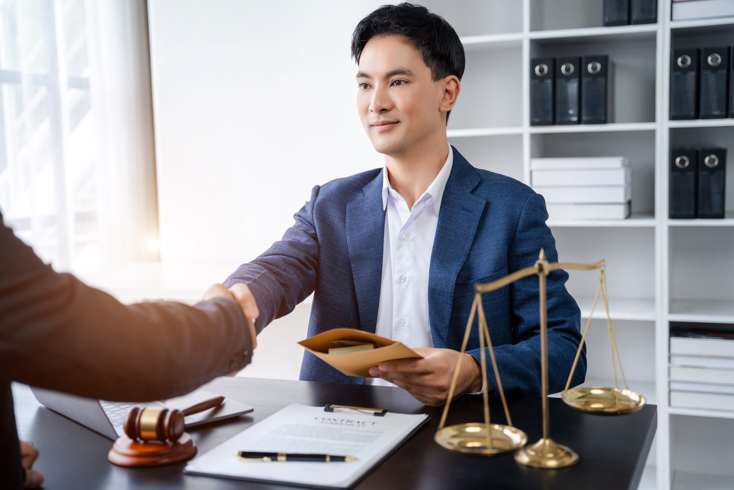 Lawyer shaking a clients hand