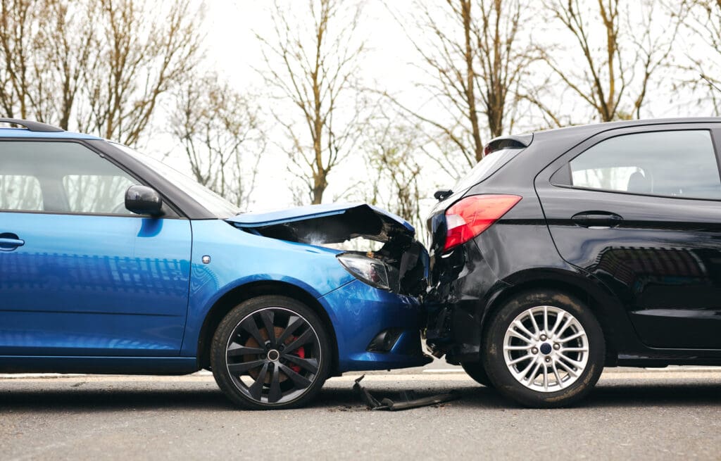 blue car rear ended black car 